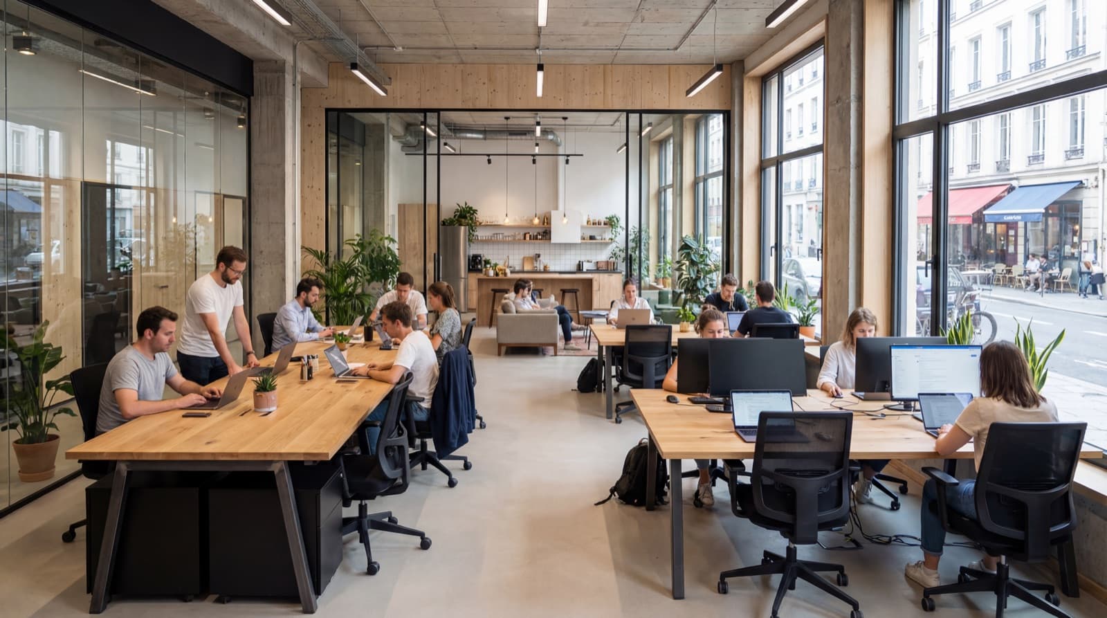 Modern open-space office with people at wooden desks